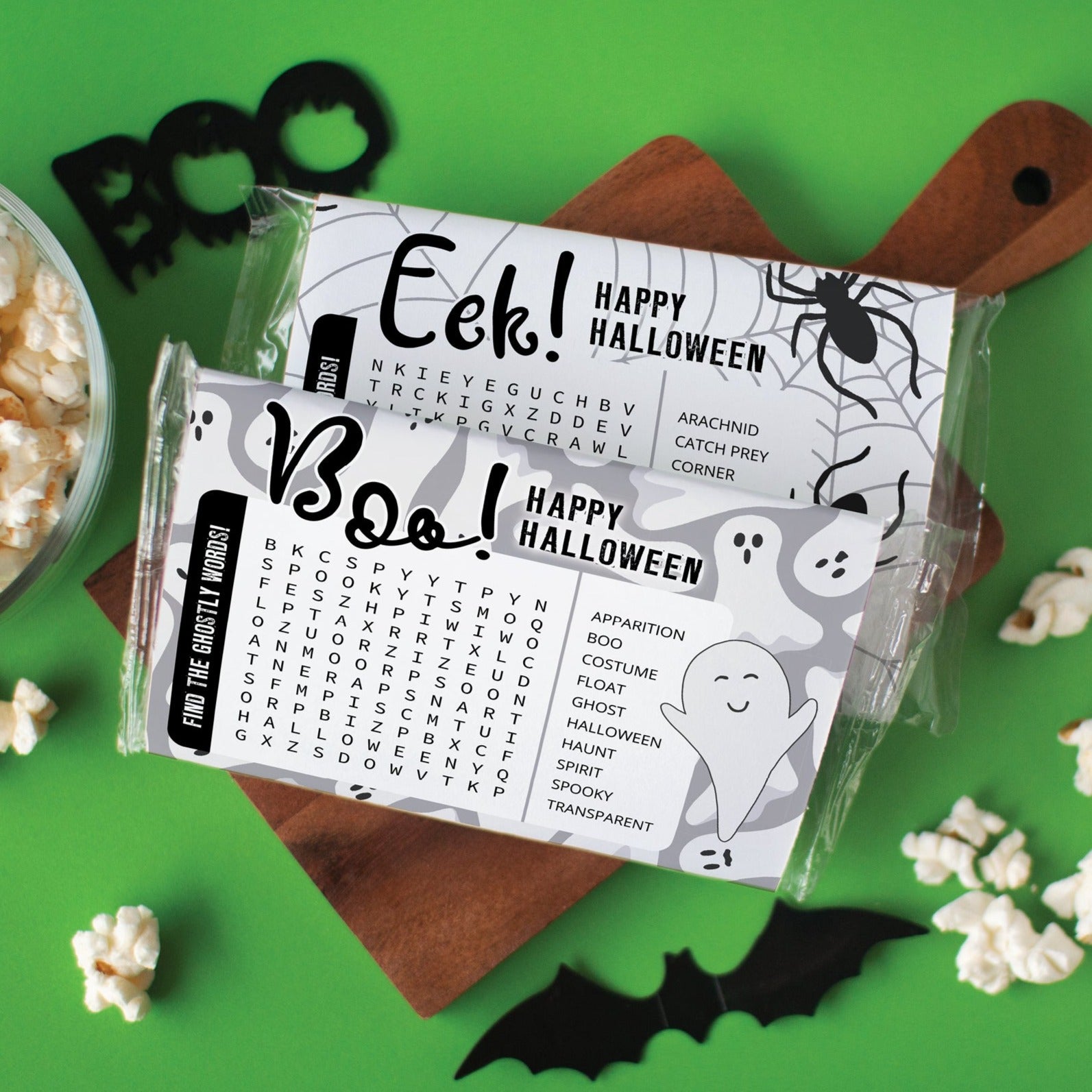 Printable popcorn wrappers with Halloween designs and word search